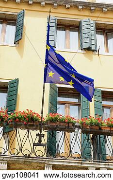 Stock Photography - low angle view 
of an european 
union flag on 
a railing,  venice. 
fotosearch - search 
stock photos, 
pictures, images, 
and photo clipart