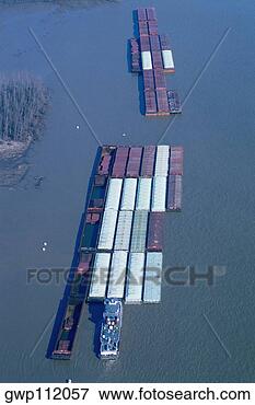 Picture - barge traffic 
on the mississippi 
rive, new orleans. 
fotosearch - search 
stock photos, 
pictures, images, 
and photo clipart