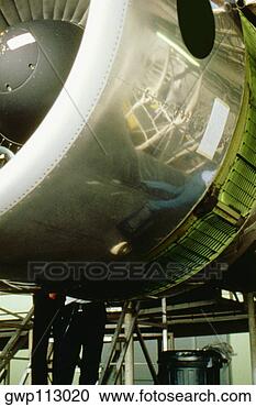 Stock Photography - close-up of a 
jet engine in 
a factory, singapore. 
fotosearch - search 
stock photos, 
pictures, images, 
and photo clipart