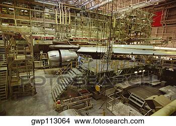Stock Photo - male mechanic 
repairing a jet 
aircraft,  tokyo 
international 
airport. fotosearch 
- search stock 
photos, pictures, 
images, and photo 
clipart