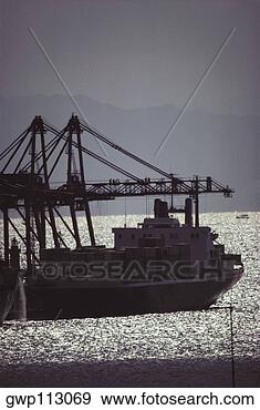 Stock Photograph - silhouette of 
a industrial ship 
in the sea, kobe, 
japan. fotosearch 
- search stock 
photos, pictures, 
images, and photo 
clipart