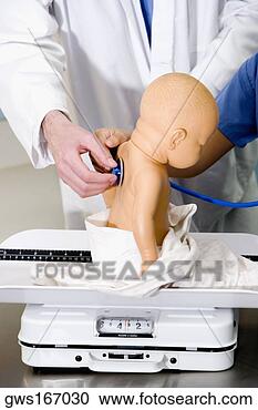 Stock Photography - close-up of a 
doll on a weighing 
scale being examined 
by a doctor. fotosearch 
- search stock 
photos, pictures, 
images, and photo 
clipart