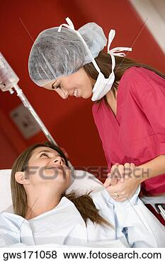 Stock Photo - close-up of a 
female doctor 
holding a female 
patient's hand. 
fotosearch - search 
stock photos, 
pictures, images, 
and photo clipart