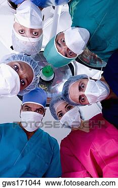 Stock Photo - low angle view 
of surgeons in 
an operating room. 
fotosearch - search 
stock photos, 
pictures, images, 
and photo clipart