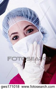 Stock Photo - portrait of a 
female surgeon 
wearing scrubs. 
fotosearch - search 
stock photos, 
pictures, images, 
and photo clipart