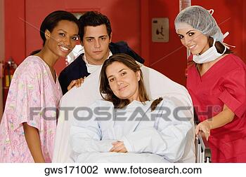 Stock Photo - two female doctors 
and a male doctor 
pushing a female 
patient on a. 
fotosearch - search 
stock photos, 
pictures, images, 
and photo clipart