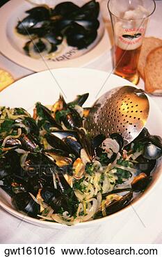 Stock Photo - high angle view 
of black mussel 
in a plate, netherlands. 
fotosearch - search 
stock photos, 
pictures, images, 
and photo clipart