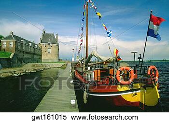Stock Image - sailboat moored 
at a dock, veere, 
netherlands. fotosearch 
- search stock 
photos, pictures, 
images, and photo 
clipart