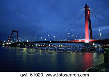 Stock Photography - suspension bridge 
across a river, 
maas river, rotterdam, 
netherlands. fotosearch 
- search stock 
photos, pictures, 
images, and photo 
clipart