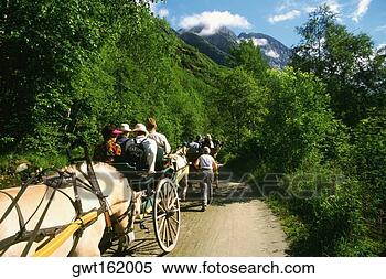 Stock Image - large group of 
people riding 
a horse cart, 
 briksdalsbreen 
glacier. fotosearch 
- search stock 
photos, pictures, 
images, and photo 
clipart