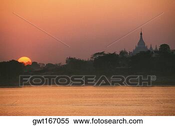Stock Image - sunset over a 
river, ayeyarwady 
river, sagaing, 
myanmar. fotosearch 
- search stock 
photos, pictures, 
images, and photo 
clipart