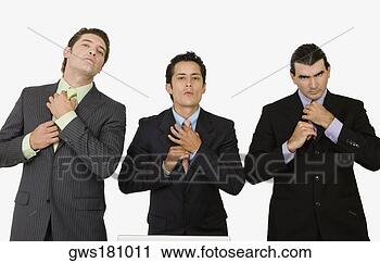 Stock Photography - portrait of three 
businessmen adjusting 
their ties. fotosearch 
- search stock 
photos, pictures, 
images, and photo 
clipart