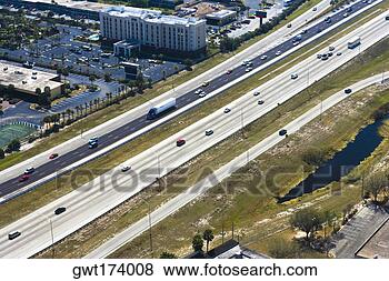 Stock Photo - aerial view of 
vehicles moving 
on multiple lane 
highways,  orlando. 
fotosearch - search 
stock photos, 
pictures, images, 
and photo clipart