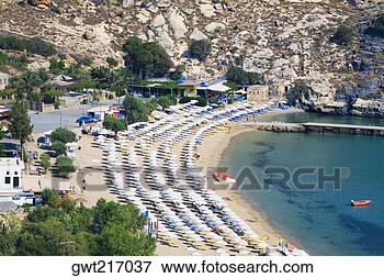 Picture - high angle view 
of a beach, lindos, 
rhodes, dodecanese 
islands, greece. 
fotosearch - search 
stock photos, 
pictures, images, 
and photo clipart