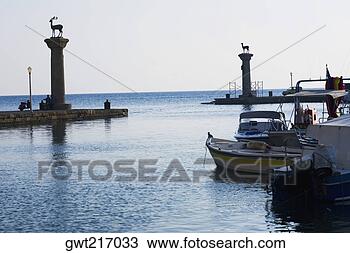 Stock Photo - monuments in the 
sea,  mandraki 
harbor,  rhodes, 
 dodecanese islands. 
fotosearch - search 
stock photos, 
pictures, images, 
and photo clipart