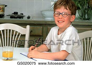 Stock Image - write, seated, 
homework, kitchen, 
sitting, at home. 
fotosearch - search 
stock photos, 
pictures, images, 
and photo clipart