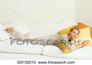 Stock Image - lying down, indoors, 
person, rest, 
resting. fotosearch 
- search stock 
photos, pictures, 
images, and photo 
clipart
