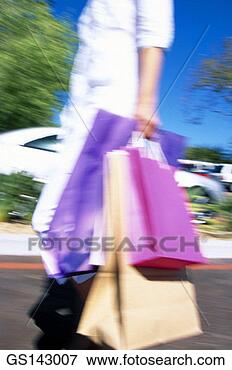 Picture - shopping, woman, 
person, thirty-something, 
outdoors. fotosearch 
- search stock 
photos, pictures, 
images, and photo 
clipart