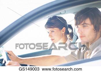 Stock Photo - couple, contre-jour, 
automobile, week-end, 
woman, person. 
fotosearch - search 
stock photos, 
pictures, images, 
and photo clipart
