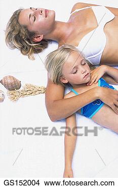 Stock Photo - calm, relaxation, 
well-being, beauty, 
bikini, affection. 
fotosearch - search 
stock photos, 
pictures, images, 
and photo clipart
