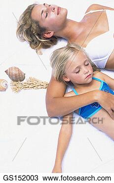 Stock Photo - lying down, relaxation, 
calm, well-being, 
bikini, affection. 
fotosearch - search 
stock photos, 
pictures, images, 
and photo clipart