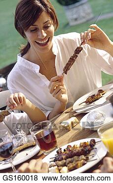 Stock Photo - brochette, barbecue, 
woman, person, 
thirty-something. 
fotosearch - search 
stock photos, 
pictures, images, 
and photo clipart
