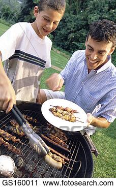 Stock Photography - brochette, grill, 
barbecue, person, 
people, thirty-something. 
fotosearch - search 
stock photos, 
pictures, images, 
and photo clipart
