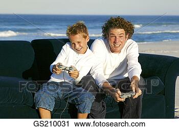 Stock Photography - people, person, 
sitting, pair, 
two, companion. 
fotosearch - search 
stock photos, 
pictures, images, 
and photo clipart