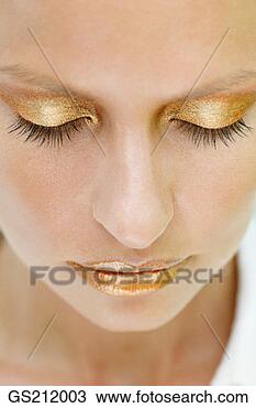 Stock Photo - lady's face with 
closed eyes and 
golden make up. 
fotosearch - search 
stock photos, 
pictures, images, 
and photo clipart