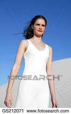 Stock Photography - lady wearing a 
long white dress, 
in the sand dunes. 
fotosearch - search 
stock photos, 
pictures, images, 
and photo clipart