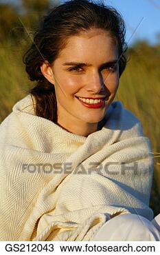 Stock Photo - lady wrapped up 
in a blanket, 
smiling. fotosearch 
- search stock 
photos, pictures, 
images, and photo 
clipart