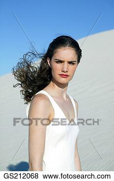 Stock Photo - portrait of a 
lady in the sand 
dunes with windswept 
hair. fotosearch 
- search stock 
photos, pictures, 
images, and photo 
clipart