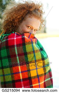 Stock Photo - red-haired woman 
wrapped up in 
a tartan rug. 
fotosearch - search 
stock photos, 
pictures, images, 
and photo clipart