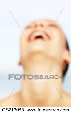 Stock Photo - hazy portrait  of a woman with  her head back  laughing. fotosearch  - search stock  photos, pictures,  wall murals, images,  and photo clipart