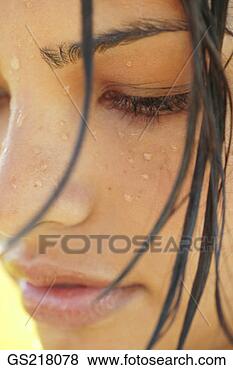 Stock Photo - close up of a 
woman's face with 
wet hair. fotosearch 
- search stock 
photos, pictures, 
images, and photo 
clipart