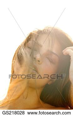 Stock Photo - hazy portrait 
of a dark-haired 
woman with closed 
eyes and tousled 
hair. fotosearch 
- search stock 
photos, pictures, 
images, and photo 
clipart