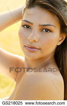 Stock Image - portrait of a 
dark-haired woman 
looking over her 
shoulder. fotosearch 
- search stock 
photos, pictures, 
images, and photo 
clipart