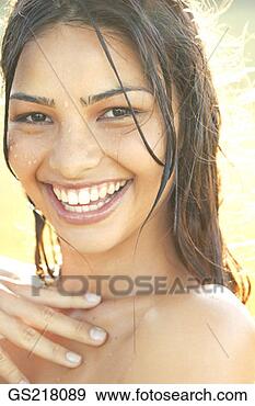 Stock Photograph - portrait of a 
smiling dark-haired 
woman with wet 
hair. fotosearch 
- search stock 
photos, pictures, 
images, and photo 
clipart