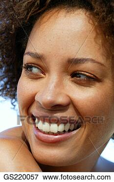 Picture - portrait of a 
smiling dark-skinned 
woman, looking 
to one side. fotosearch 
- search stock 
photos, pictures, 
images, and photo 
clipart