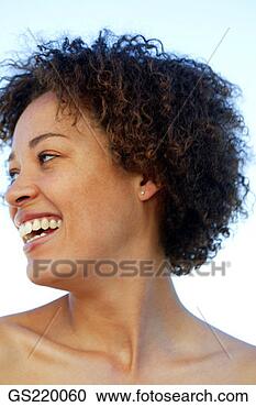 Stock Photography - side profile of 
a laughing dark-skinned 
woman, looking 
to one side. fotosearch 
- search stock 
photos, pictures, 
images, and photo 
clipart