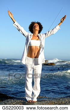 Stock Photo - woman with outstretched 
arms on the seashore. 
fotosearch - search 
stock photos, 
pictures, images, 
and photo clipart