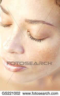 Stock Photo - close up of a 
woman's face with 
closed eyes. fotosearch 
- search stock 
photos, pictures, 
images, and photo 
clipart