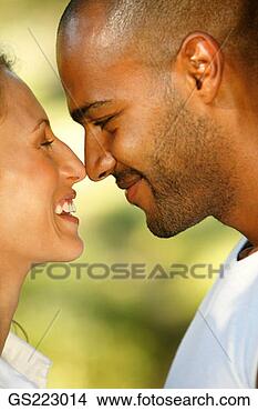 Stock Photo - side profile of 
a happy couple 
touching nose 
to nose. fotosearch 
- search stock 
photos, pictures, 
images, and photo 
clipart