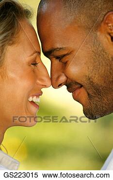 Stock Image - side profile of 
a happy couple 
touching nose 
to nose. fotosearch 
- search stock 
photos, pictures, 
images, and photo 
clipart