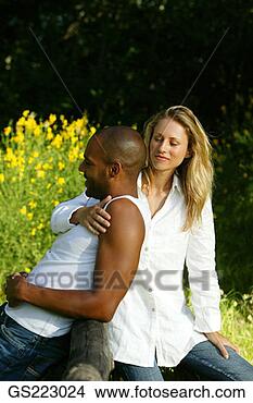 Stock Photo - woman with arm 
around man's shoulder. 
fotosearch - search 
stock photos, 
pictures, images, 
and photo clipart