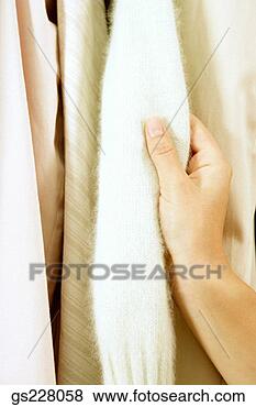 Stock Photo - hand touching 
shirts. fotosearch 
- search stock 
photos, pictures, 
images, and photo 
clipart