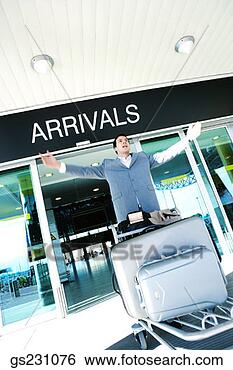 Stock Photo - businessman celebrating 
his arrival at 
airport. fotosearch 
- search stock 
photos, pictures, 
images, and photo 
clipart