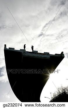 Stock Photo - two people standing 
on edge of unfinished 
overpass. fotosearch 
- search stock 
photos, pictures, 
images, and photo 
clipart