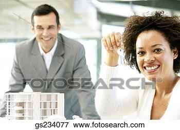 Picture - architect proudly 
displaying keys. 
fotosearch - search 
stock photos, 
pictures, images, 
and photo clipart