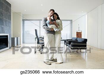 Stock Photo - family posing 
in home office. 
fotosearch - search 
stock photos, 
pictures, images, 
and photo clipart